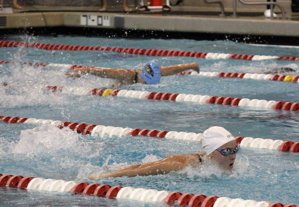 Green Valley’s Elizabeth Clinch, right, competes in the 100-yard butterfly at the Clas ...