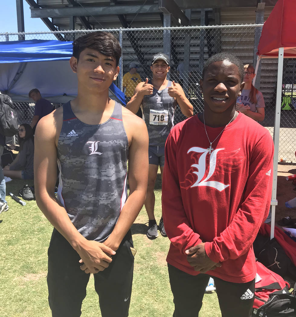 Liberty sprinters Rudy Distrito and Tyeese Blackman pose at the Sunrise Region track meet af ...