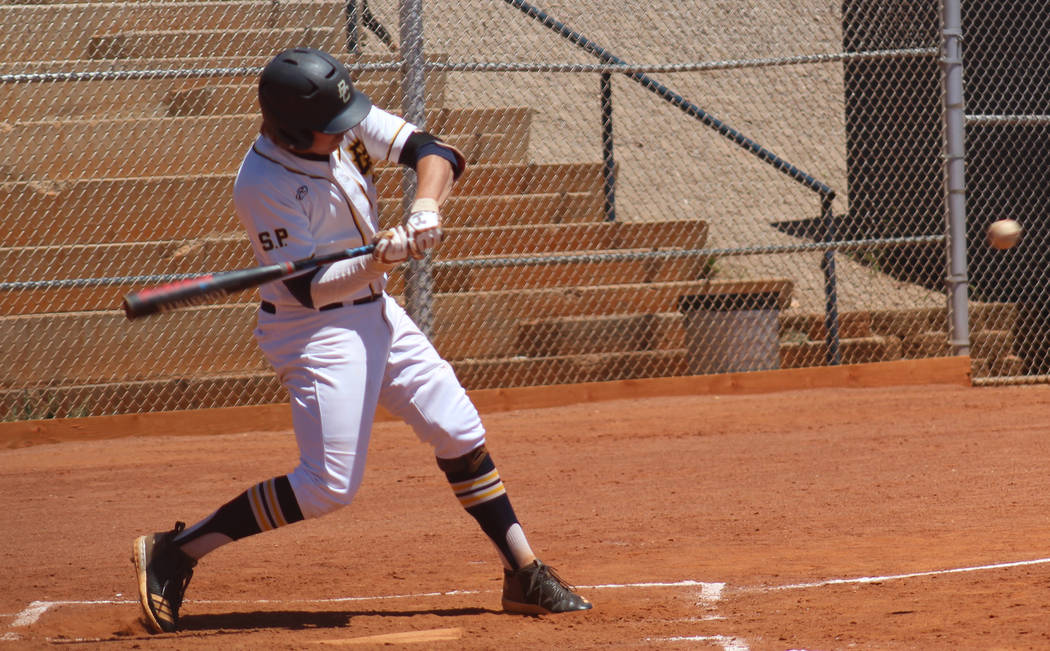 Boulder City’s Rhett Armstrong takes a swing against Pahrump Valley on Saturday, May 1 ...