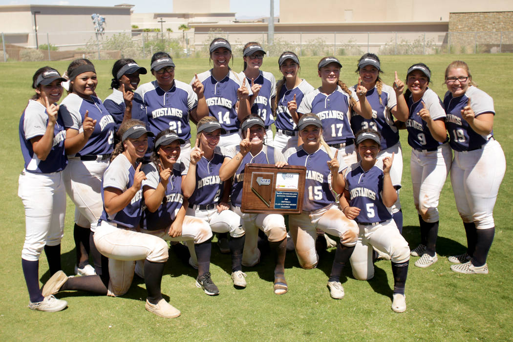 The Shadow Ridge Girls Softball team poses with their trophy after defeating Palo Verde to c ...