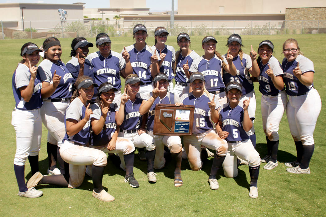 The Shadow Ridge Girls Softball team poses with their trophy after defeating Palo Verde to c ...