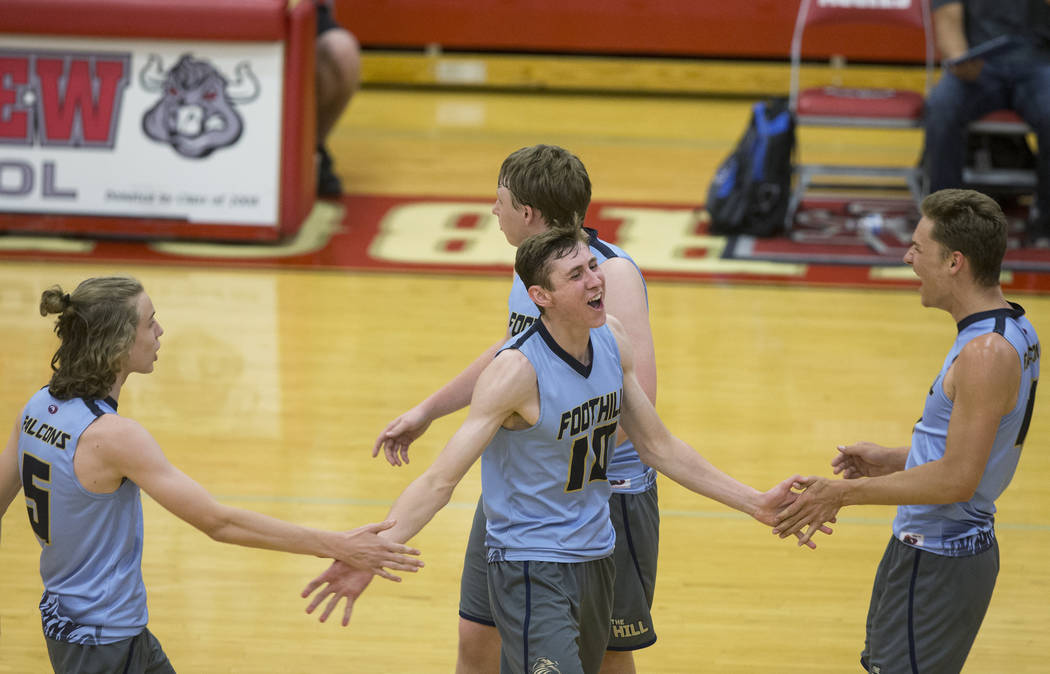 Foothillsjunior Caleb Stearman (10) celebrates with teammates after scoring a point during t ...