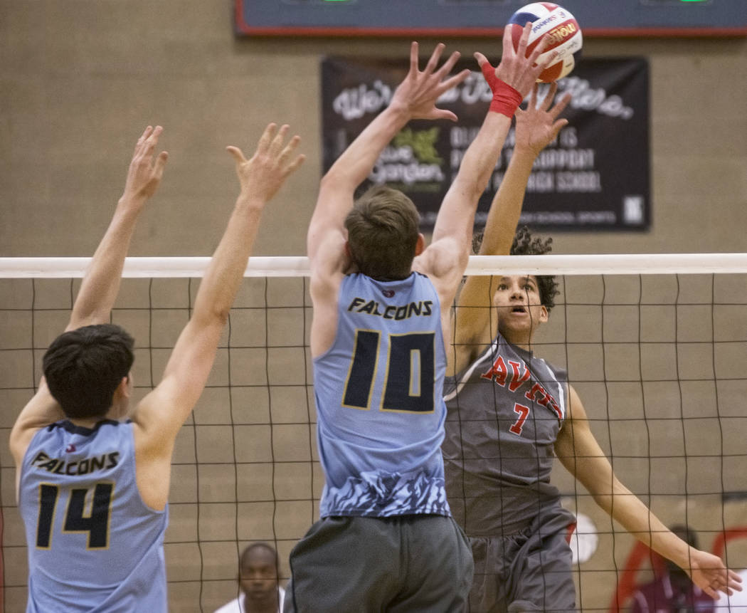 Arbor View senior Keandre Suares (7) makes a kill past Foothill’s Caleb Stearman (10) ...