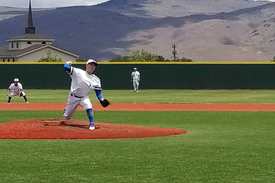 Basic’s C.J. Dornak fires a pitch against Reno in the Class 4A state baseball tourname ...