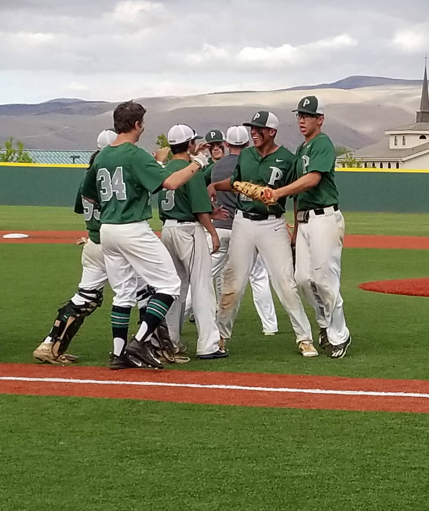 Jaret Godman is congratulated by teammates after recording the final out against Bishop Mano ...