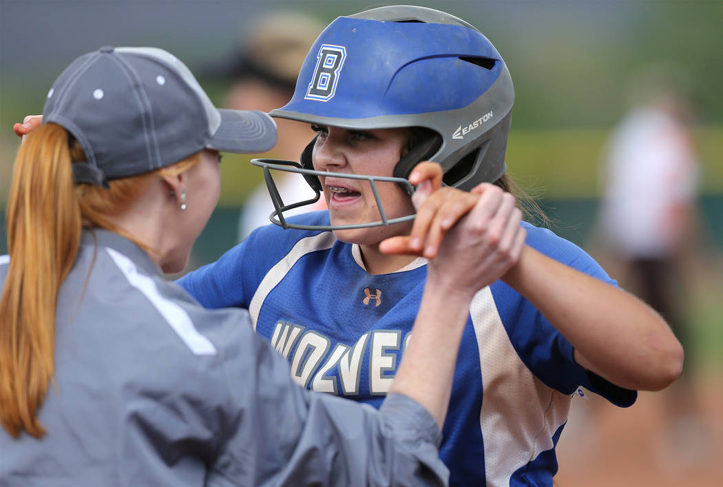 Basic Wolves’ Mikayla Berg celebrates a hit in the bottom of the seventh inning agains ...