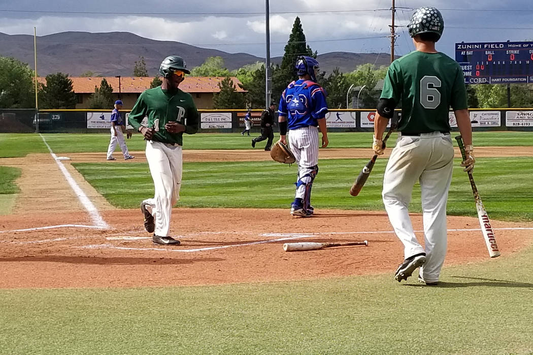 Palo Verde’s Scott Cosby scores the first run against Reno in the Class 4A state baseb ...