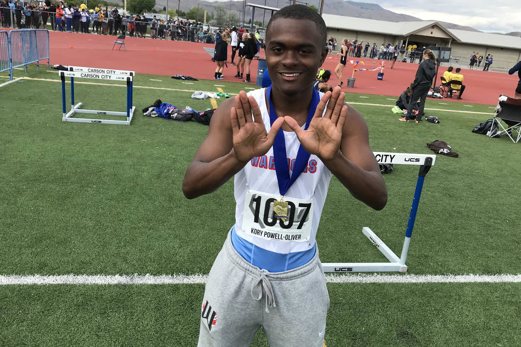 Western senior sprinter Korey Powell-Oliver forms a “W” with his hands after win ...