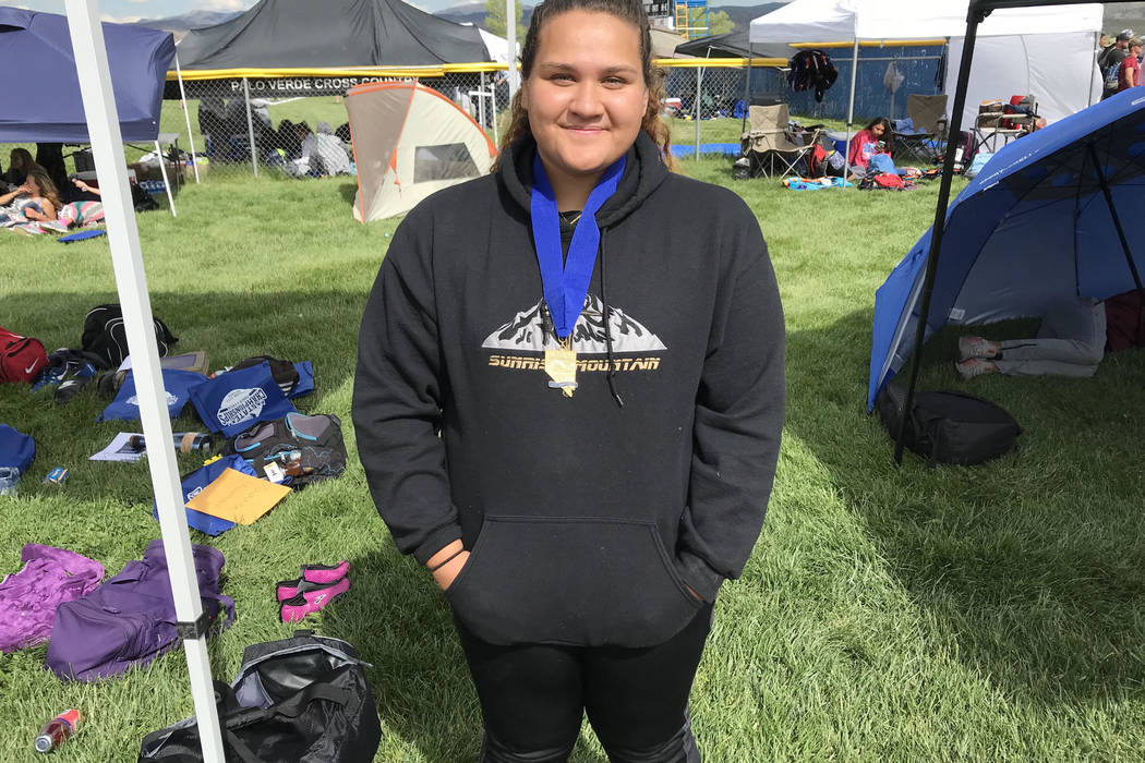 Sunrise Mountain junior thrower Kapua Pulotu poses after winning the Class 3A discus state c ...