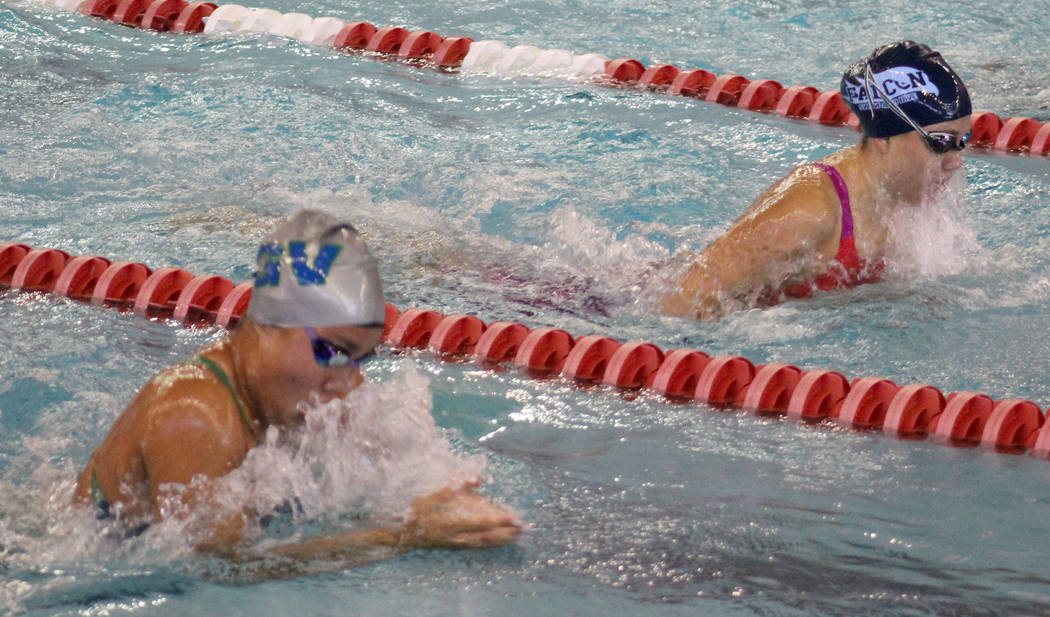 Green Valley’s Rain Gavino, bottom, competes in the 100 breaststroke during the Class ...