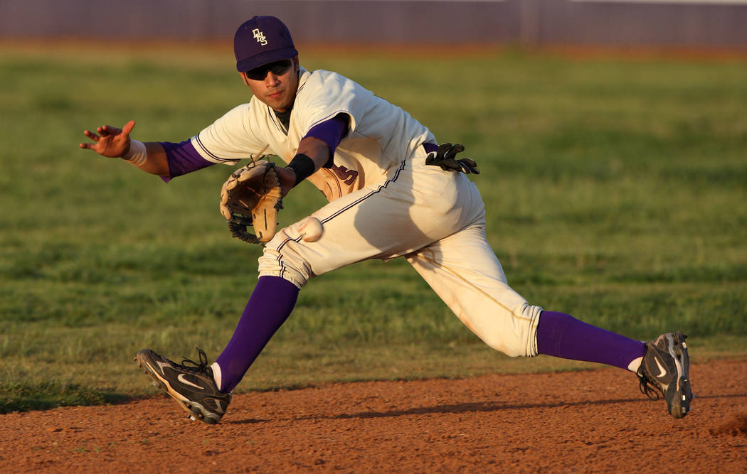 Durango High School baseball player Niko Vasquez fields a ground ball during a baseball game ...