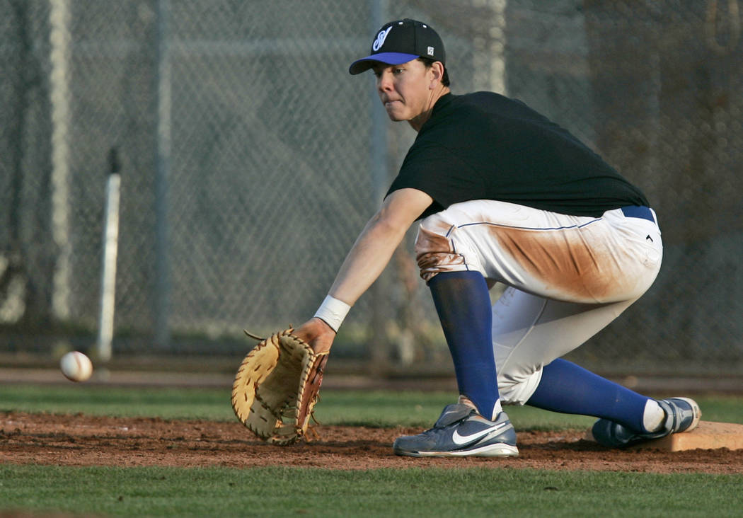 Sierra Vista High School baseball player Nick Kingham makes a catch at first base for an out ...