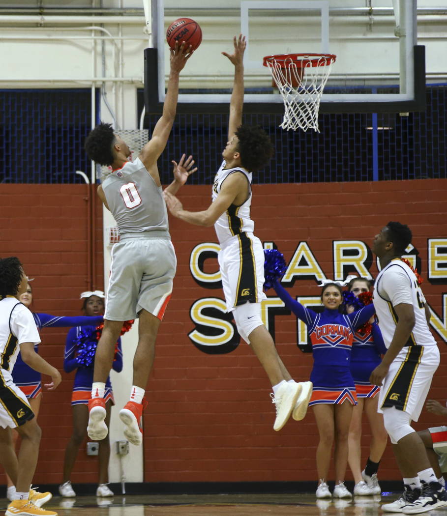 Bishop Gorman’s Isaiah Cottrell (0) goes to the basket as Clark’s Jalen Hill (21 ...