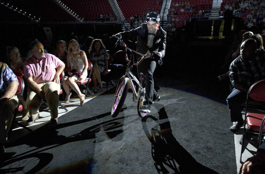 Professional BMX rider and television personality Ricardo Laguna rides to the stage before p ...