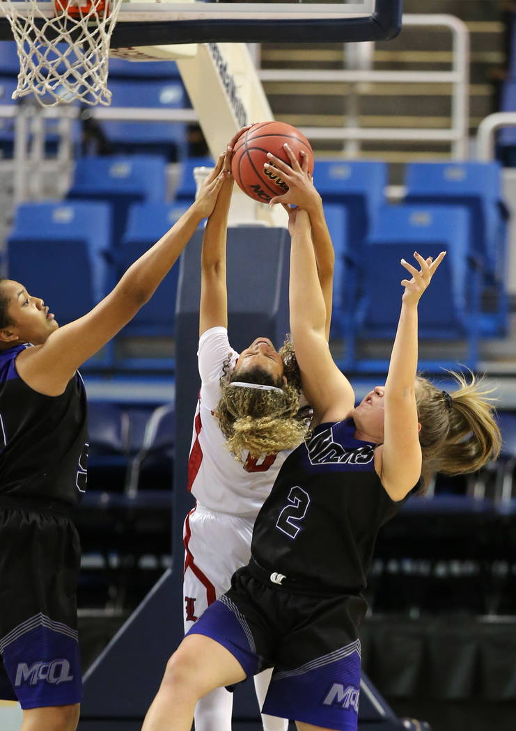 Liberty’s Rae Burrell, center,ʠfights for a rebound with McQueen’s Alisi ...