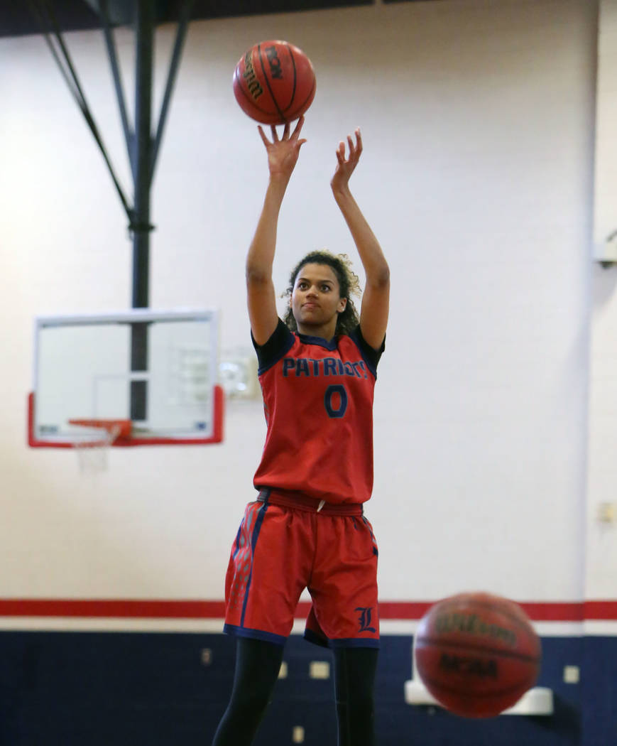 Liberty High’s Rae Burrell shoots for the basket during teams practice at their school ...