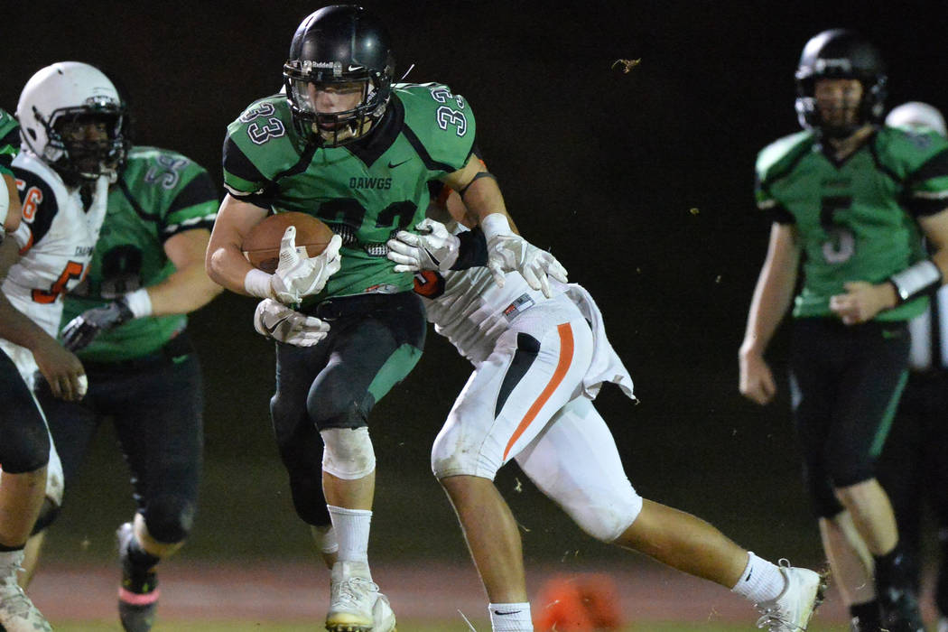 Virgin Valley running back Maurice Jayden Perkins (33) runs the ball during the Virgin Valle ...