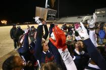 Coronado’s Jensen Boman (18) raises the trophy while celebrating with teammates after ...