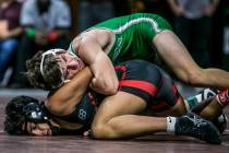 Justus Scott of Green Valley, top, and Jakob Alvarado of Las Vegas wrestle in the 4A 152 pou ...