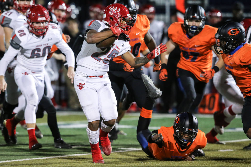 Arbor View’s Kyle Graham-Robinson (25) runs the ball against Bishop Gorman during the ...