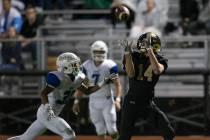 Faith Lutheran’s Peyton Thornton (14) reaches for a catch against Green Valley in the ...