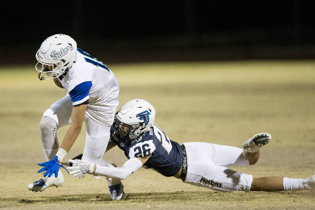 Green Valley’s Kalyja Waialae (18) runs the ball against Foothill’s Jace Derrybe ...