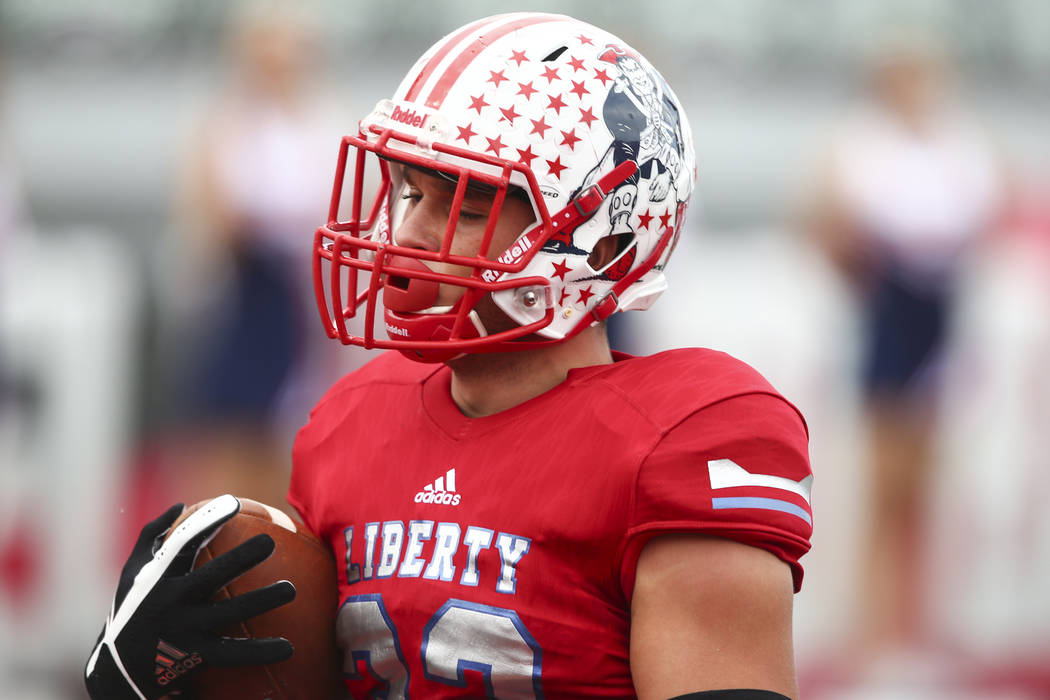 Liberty’s Kyle Beaudry (32) scores a touchdown during a football game against Alta at ...