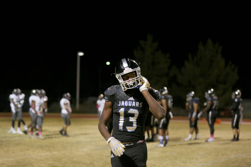 Desert Pines’ Darnell Washington, 13, takes off his helmet during a game against Sunr ...