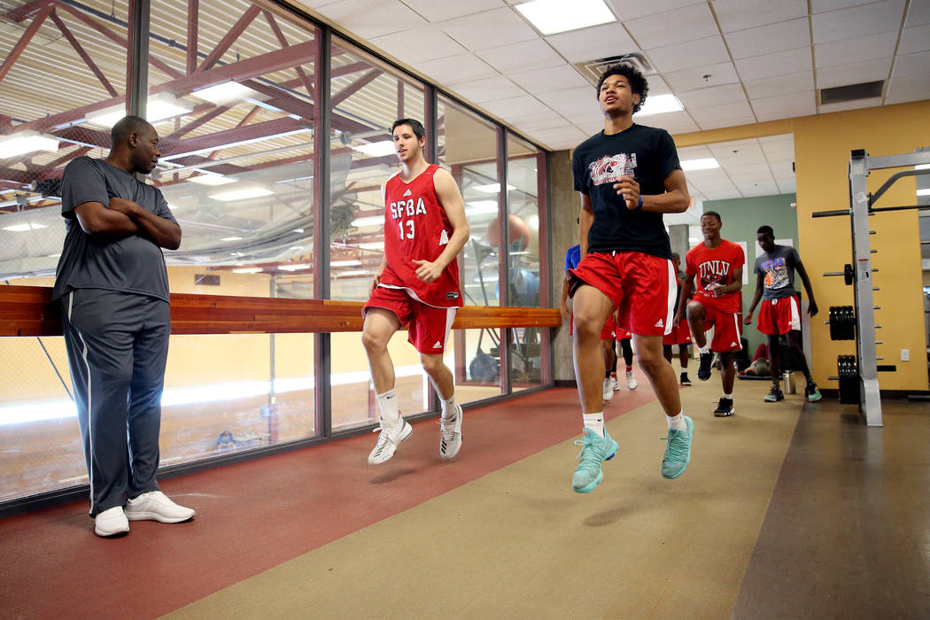 Daishen Nix, right, 16, with his teammate Jovan Sljivancanin, 19, during a fitness training ...