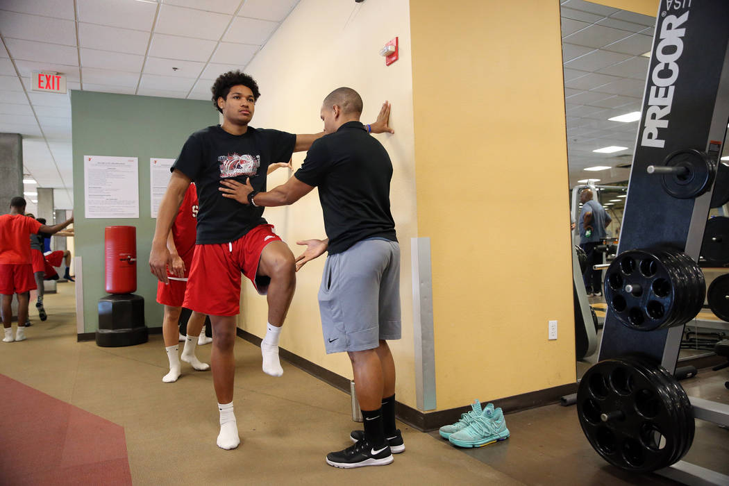 Daishen Nix, left, 16, works with Charles Sams, sports and conditioning trainer at YMCA, dur ...