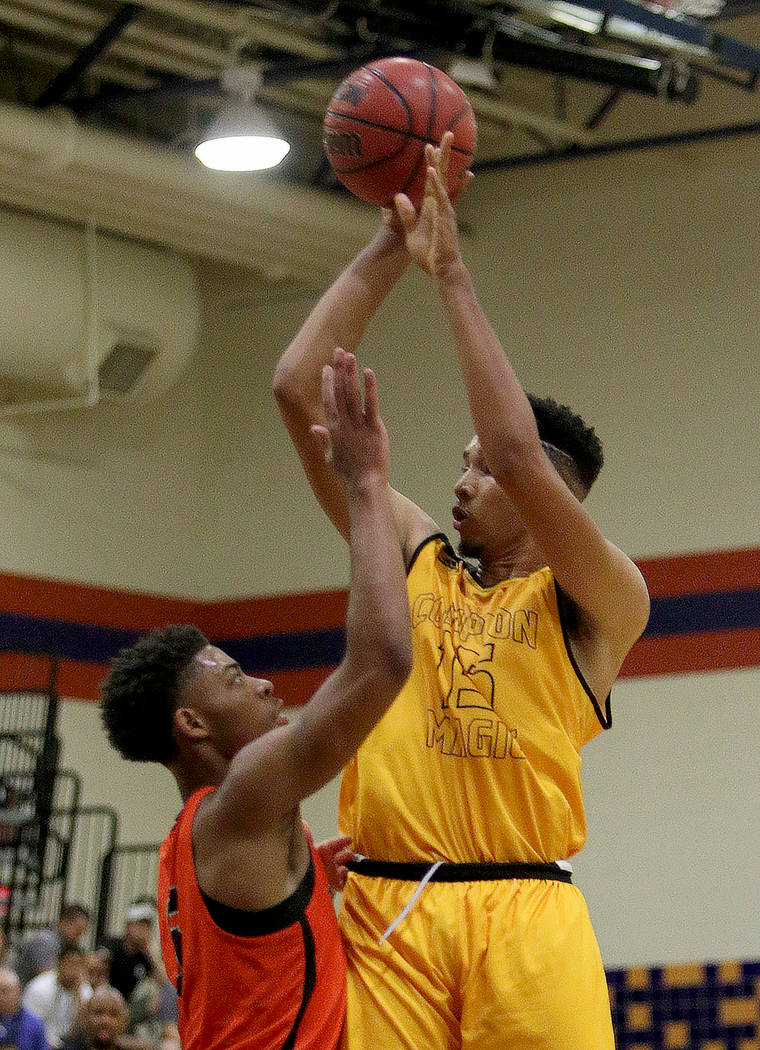 Compton Magic’s Isaiah Mobley (15) tries for a three pointer against Bishop Gorman&#82 ...