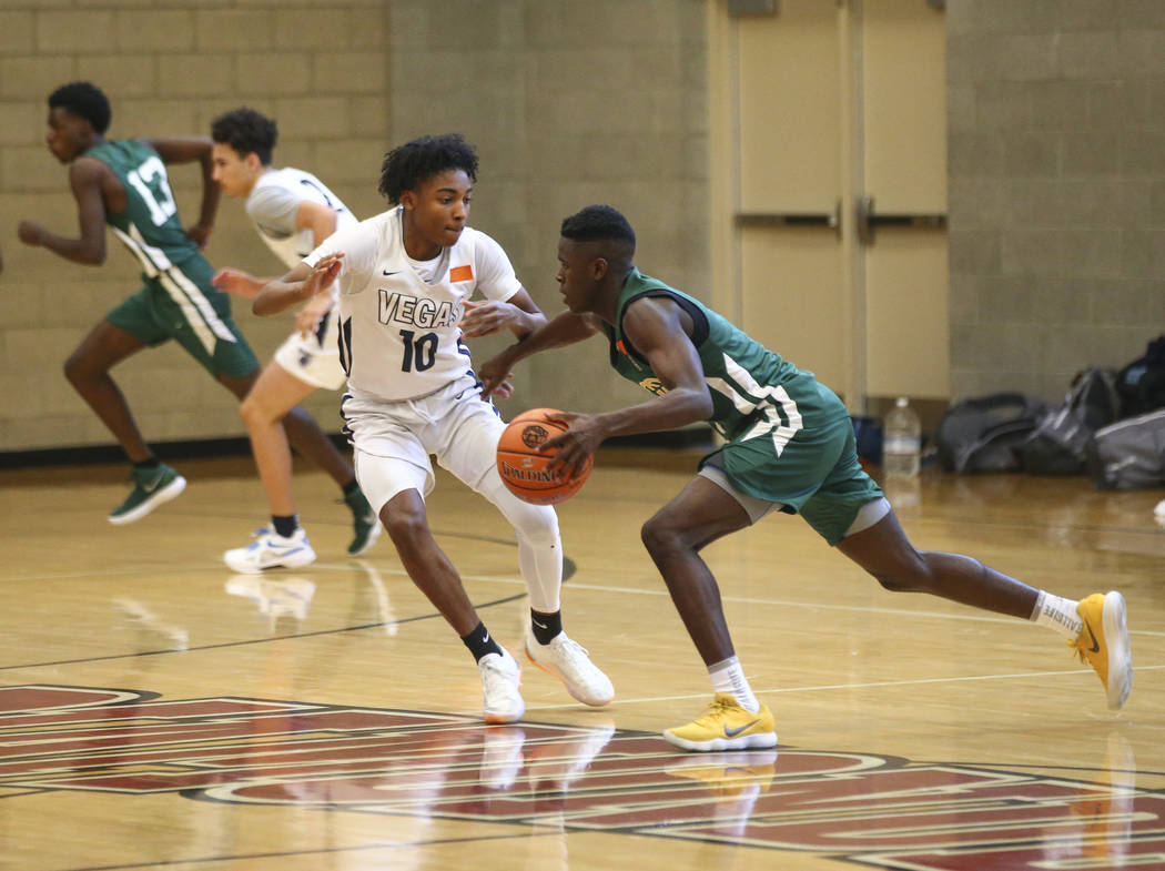 Vegas Elite guard Zaon Collins (10) defends a player from We All Can Go as part of the Fab 4 ...