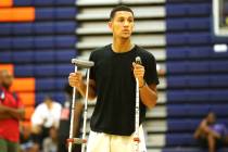 Grassroots Sizzle’s Jalen Suggs watches his team warm up for their basketball game at ...