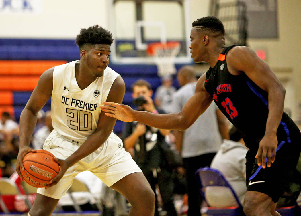 DC Premier’s Makhel Mitchell (20) gets ready to pass by The Truth’s Prince Gilli ...