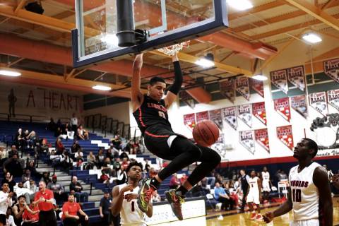 Liberty High School’s Julian Strawther (0) slam dunks in a game against Coronado High ...