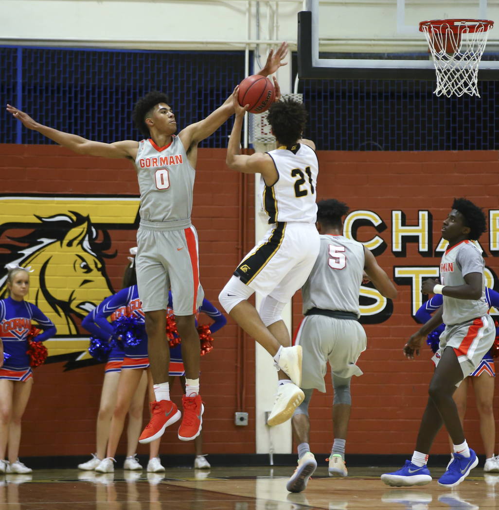 Clark’s Jalen Hill (21) goes up to shoot as Bishop Gorman’s Isaiah Cottrell (0) ...