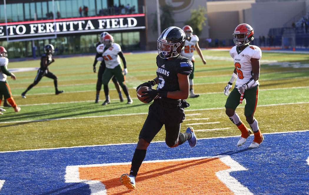 Desert Pines wide receiver Tye Moore (2) makes a catch for a touchdown against Mojave in the ...