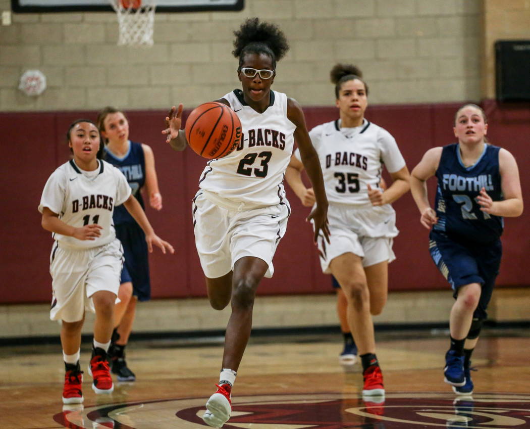 Desert Oasis’ Desi-rae Young (23) dribbles the ball up court during the second quarter ...