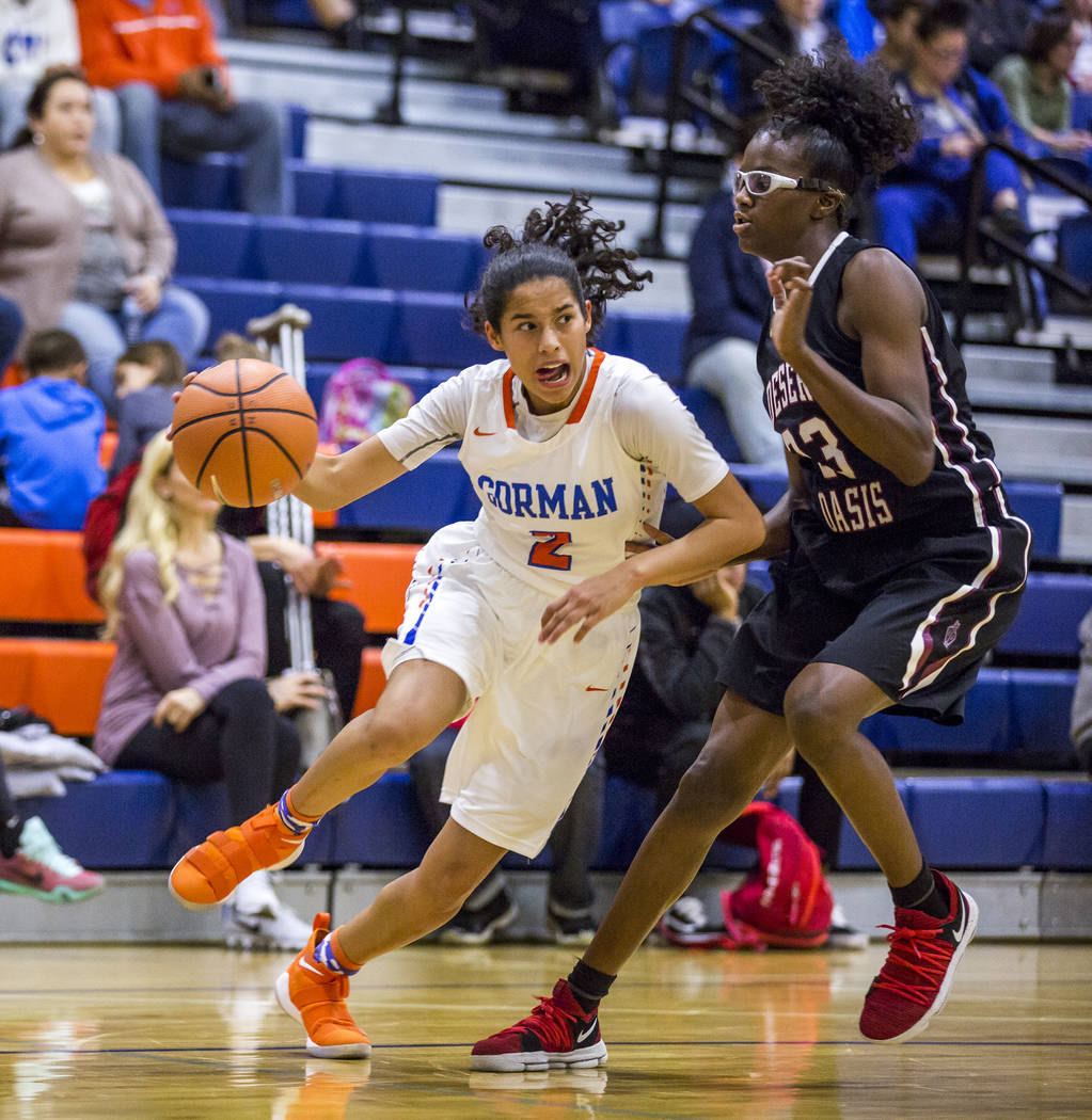 Bishop Gorman’s Shaira Young attempts to dribble past Desert Oasis’ Desi-rae You ...