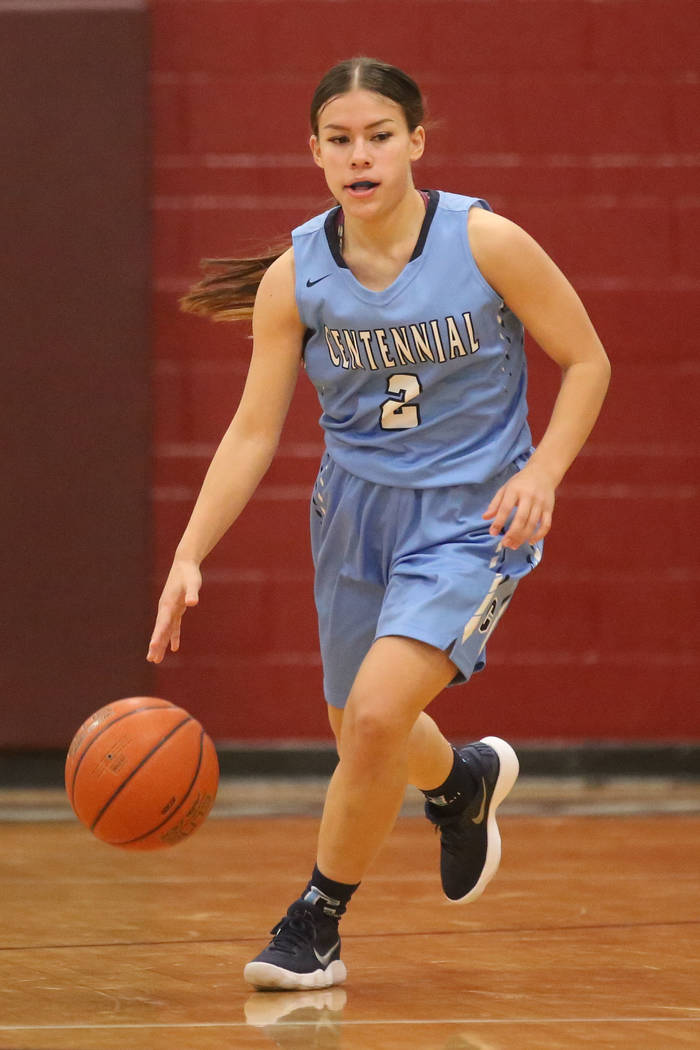 Centennial basketball player Melanie Isbell (2) handles the ball during a game against Cimar ...