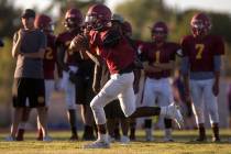 Del Sol sophomore Maalik Flowers runs with the ball during a three-team scrimmage at Del Sol ...