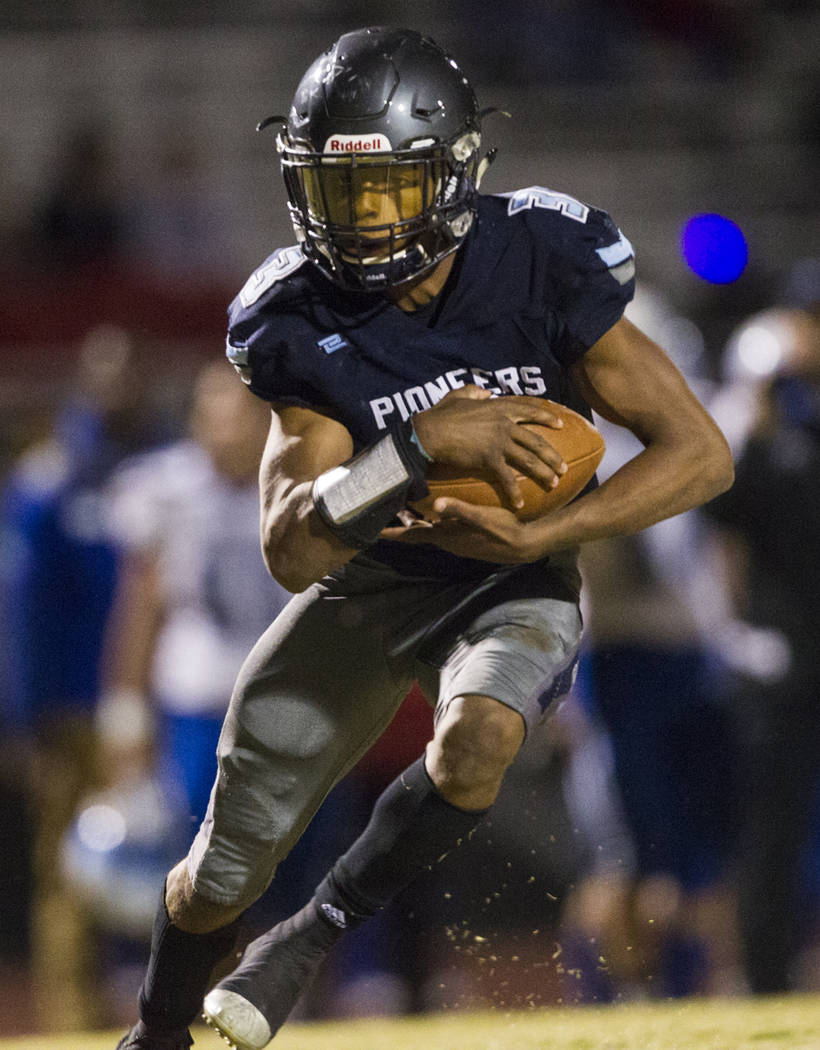 Canyon Spring’s Jayvion Pugh (3) runs the ball against Basic during their playoff foot ...
