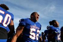 Liberty player Javon Motley (52) screams as him and hhis tames get pumped up for their class ...