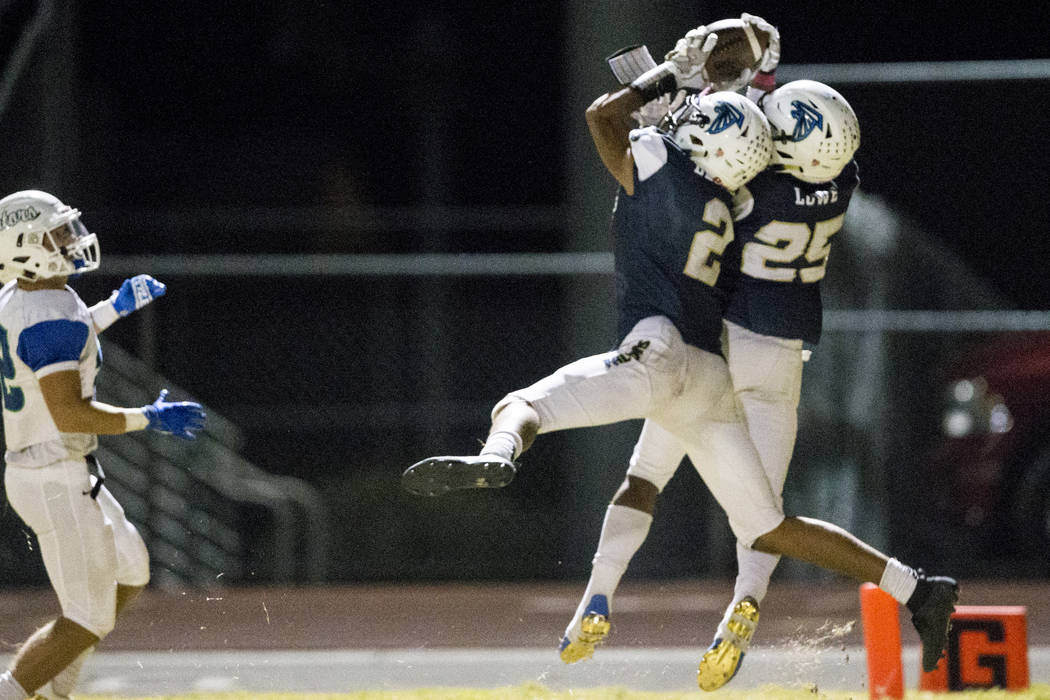 Foothill’s Jordan Blakely (2) intercepts the ball against Green Valley in the football ...