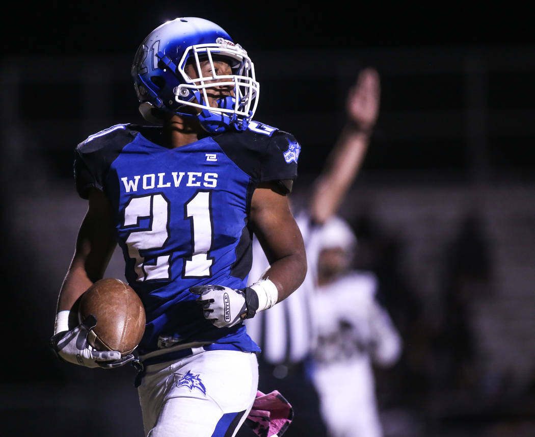 Basic’s Dorian Ivan McAllister (21) scores against Foothill during the fourth quarter ...