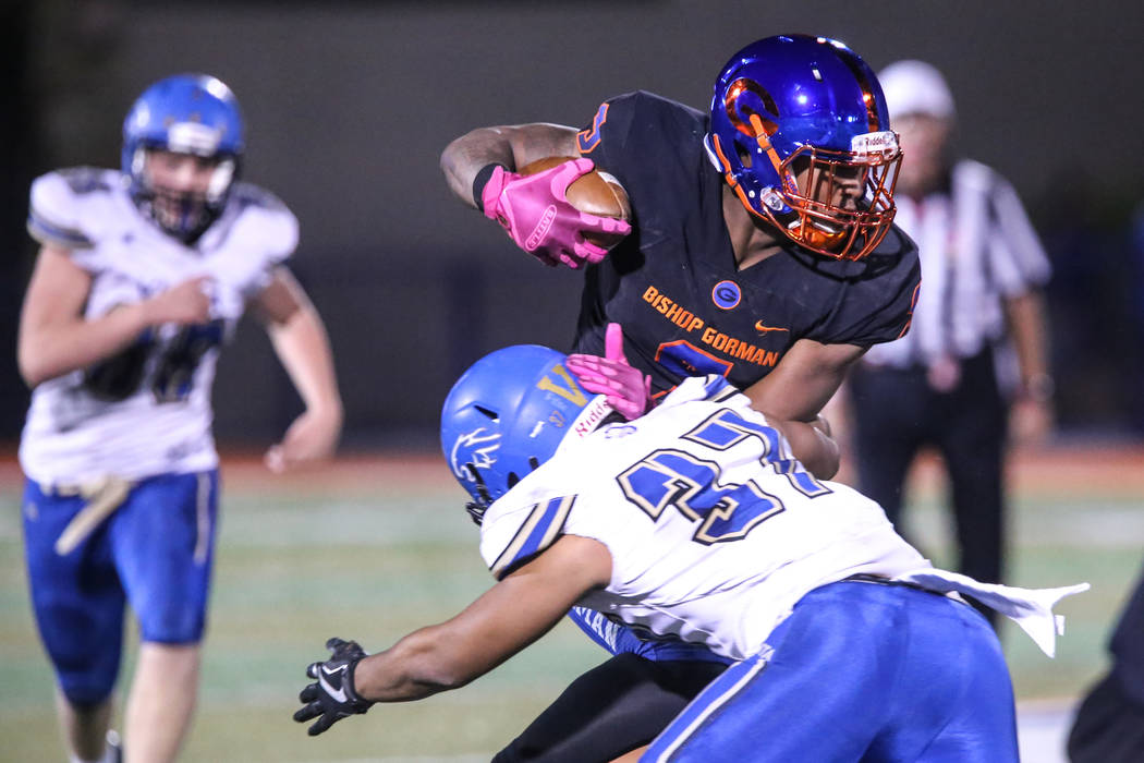 Bishop Gorman’s Brevin Jordan (9), top, is tackled by Sierra Vista’s Jahsiaah Ma ...