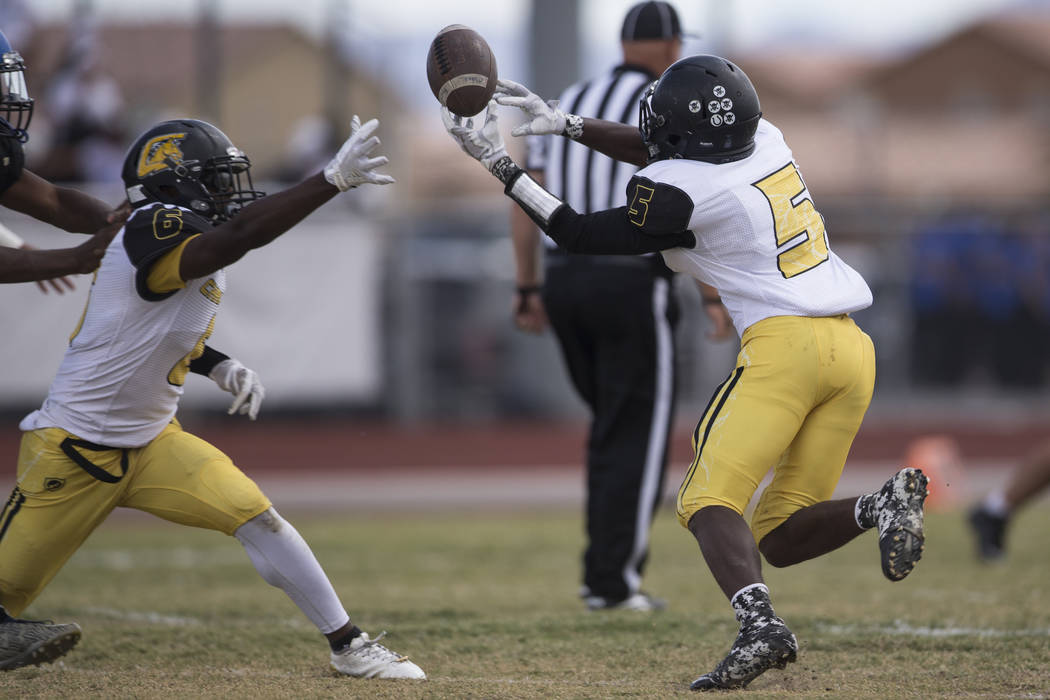 Clark’s Isaiah Veal (5) reaches for a dropped pass against Sierra Vista in their footb ...