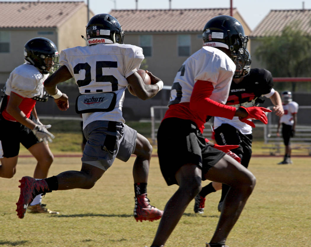 Running back Cody Summer (25) runs the ball down the field for a practice drill during the W ...