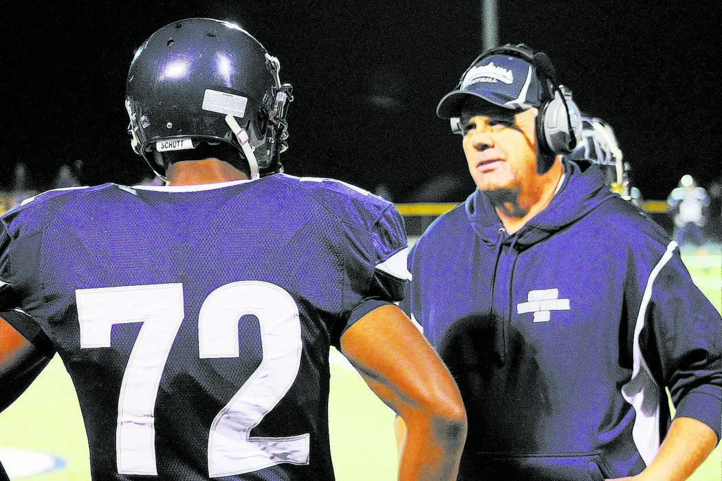 Meadows football player Mark Woodson gets defensive instructions from assistant coach Jack C ...