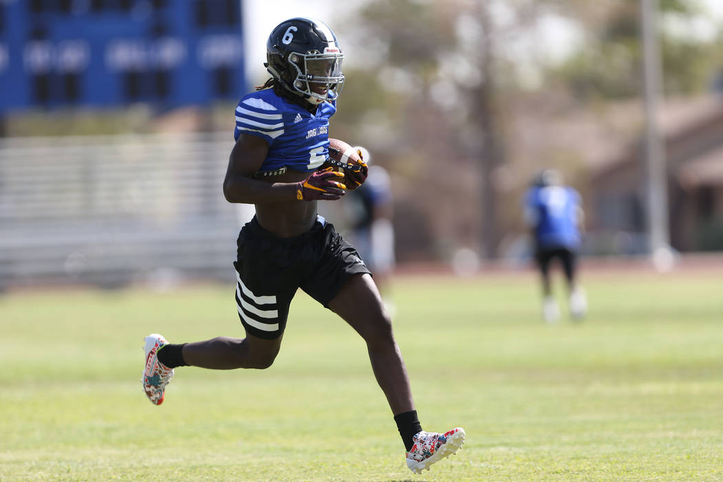 Desert Pines senior running back Cameron Wiley runs the ball during a team practice at Deser ...